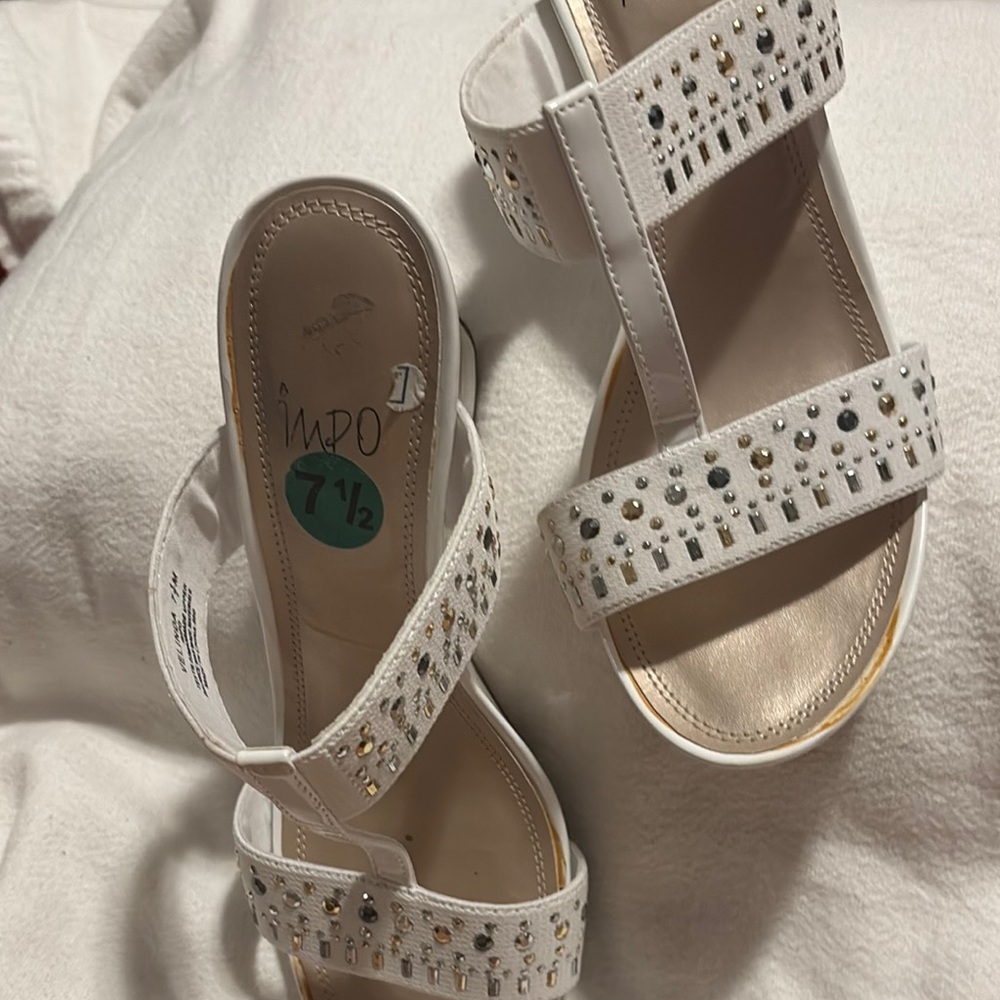 Impo White Sandals with Intricate Straps
Wall01